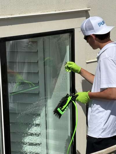 Professional window cleaning on a Sandy, UT foothill home
