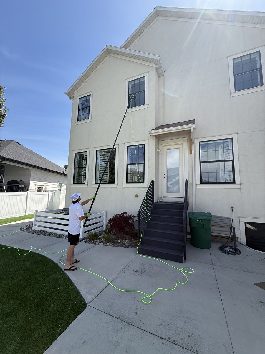 Wide shot of full home window washing in progress